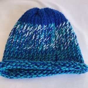 Knitted blue, teal, and white beanie hat